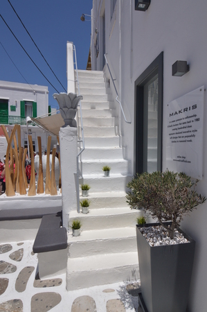 Nice Stairs That End In Typical Blue Doors In The Picturesque Streets Very Narrow In Chora Island Of Mikonos .Arte History Architecture July 3, 2018. Chora, Mykonos Island, Greece.のeditorial素材