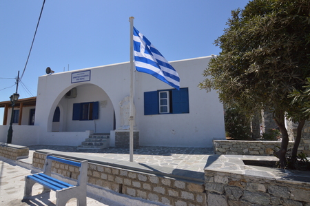 Building With Its Typical Blue Doors And Windows In Ano Mera On The Island Of Mykonos. Architecture Landscapes Travels Cruises. July 3, 2018. Ano Mera, Island of Mikonos Greece.のeditorial素材