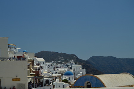 Endless Line Of Houses On Mountain Summit In Oia On Santorini Island. Architecture, landscapes, travel, cruises. July 7, 2018. Island of Santorini, Thera. Greece.の写真素材
