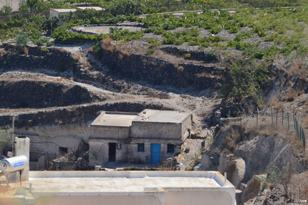 Warehouse, Cellar In A Vineyard Sowing In The Volcanic Land In Pyrgos. Fruit Plants, Nature, Landscapes, Travel. July 7, 2018. Pyrgos Island Santorini Greece.の写真素材