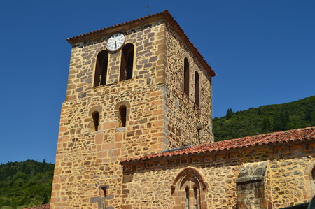 Clock Tower Of The Old Church Of San Vicente In Pots Dated From Medieval Times In Villa De Potes. Nature, Architecture, History, Travel. July 30, 2018.Potes, Cantabria, Spainのeditorial素材