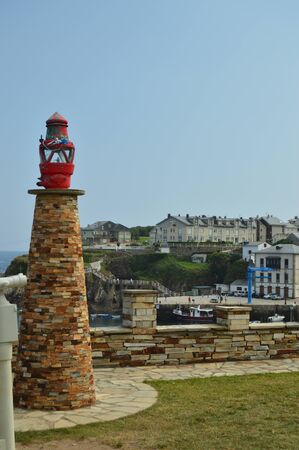 Monument With A Lantern With The Fishing Port To The Bottom In Tapia De Casariego. Nature, Travel, Recreation. August 2, 2018.Tapia De Casareigo, Asturias, Spain.のeditorial素材