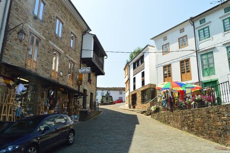 Streets With Slate Buildings With Shops On Its Ground Floor Leading To A Beautiful Square In Taramundi, Asturias, Spain. Architecture, History, Travel. August 2, 2018のeditorial素材