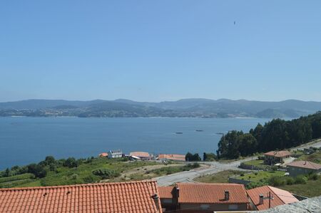 Raxo Bay With The Mussel Hatcheries In It. Nature, Architecture, History. August 19, 2014. Raxo, Pontevedra, Galicia, Spain.のeditorial素材