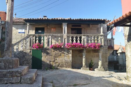 Stone House Full Of Roses Flowers In The Beautiful Village Of Combarrro. Nature, Architecture,...