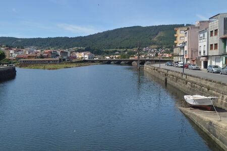 Bridge On The River Traba Before Flowing Into The Ria In Noya. Nature, Architecture, History, Street Photography. August 19, 2014. Noia, La Coru? ? a, Galicia, Spain.のeditorial素材