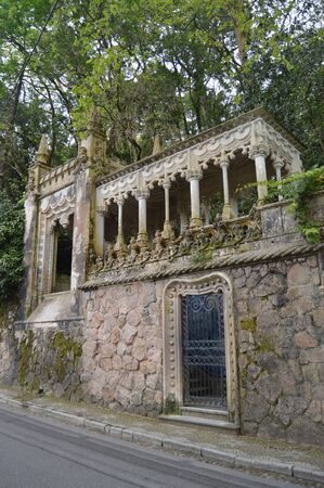 Entrance Quinta De La Regaleira Historical Center UNESCO Heritage Built By Carvalho Monteiro In The Seventeenth Century Of Roman, Gothic, Renaissance And Manuelina In Sintra. Nature, architecture, history, street photography. April 13, 2014. Sintra, Lisboのeditorial素材