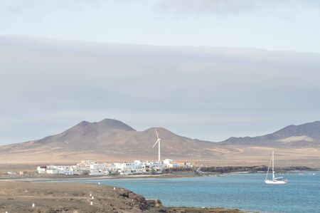 Beautiful Landscape Of The Bay With A Sailboat And The Village Of Pajara At The Bottom At Punta...