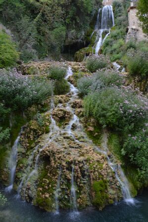 Wonderful Waterfalls With Silk Effect Of A Crystalline Greenish Water In Orbaneja Del Castillo. August 28, 2013. Orbaneja Del Castillo, Burgos, Castilla Leon, Spain. Vacation Nature Street Photography.のeditorial素材