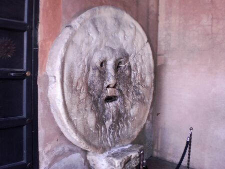 Mouth Of Truth Is An Old Pavonazzetto Marble Mask Placed On The Wall Of The Pronaos Of The Church Of Santa Maria In Cosmedin In The 17th Century In Rome. March 28, 2010. Rome, Italy, Europe. Travel Tourism Street Photographyのeditorial素材