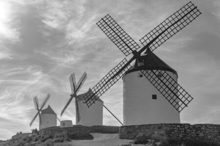 Black And White Photography Of Set of windmills dating back to the 19th century on top of Cerro Calderico in Consuegra. December 26, 2018. Consuegra Toledo Castilla La Mancha Spain Europe. Travel Tourism Street Photography.の写真素材