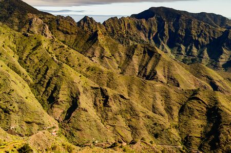 Green Slopes Falling Over The Valley In The Mist Of The Summit In La Gomera. April 15, 2019. La Gomera, Santa Cruz De Tenerife Spain Africa. Travel Tourism Photography Nature.の写真素材