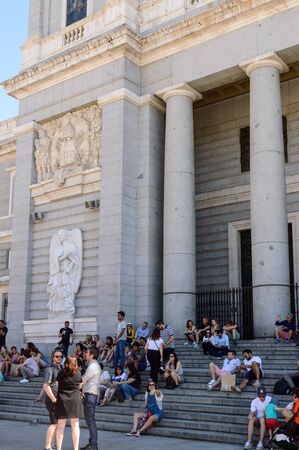 Rest place for tourists on the stairs of the Almudena cathedral. June 15, 2019. Madrid. Spain....