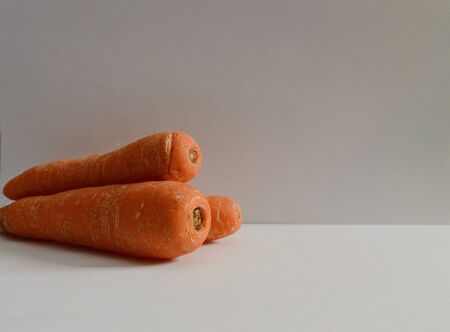 Group Of Three Fresh Carrots On White Backgroundの写真素材