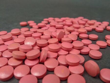 varieties of pills stacked with each other you throw a lump