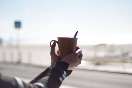Woman drinking coffee in her campervanの写真素材