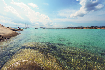 Turquoise waters of the rocky wild beach of Testa di Polpo in La Maddalena, Sardinia, Italyの写真素材
