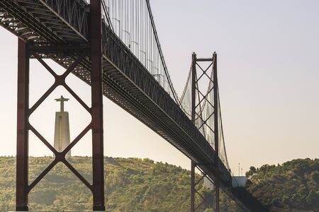 spectacular view of 25 April suspension bridge over Tagus river and Cristo Rei (Christ the King)...