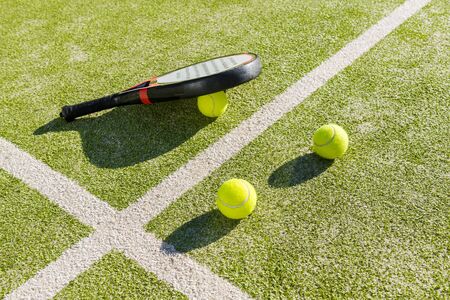 paddle tennis objects on court of artificial grass, indoor sports concept and sporty lifestyle