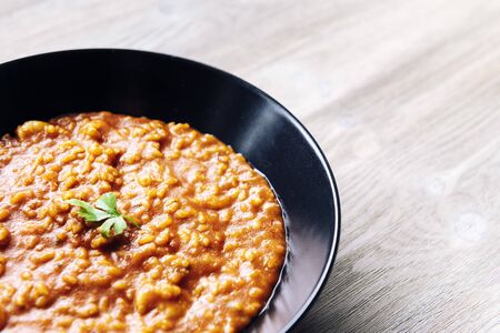 detail of a traditional rice on a white wood table, healthy home cooking concept, copy space for textの写真素材