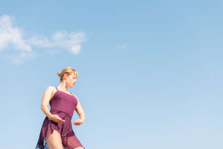 feet of an unrecognizable runner with running shoes on a wooden floor, concept of sport and healthy lifestyle, copy space for textの写真素材