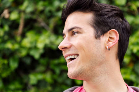 portrait of a cheerful young man smiling, concept of happiness and teenager lifestyle, copy space...