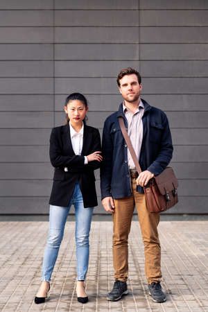 confident entrepreneur couple looking at cameraの写真素材