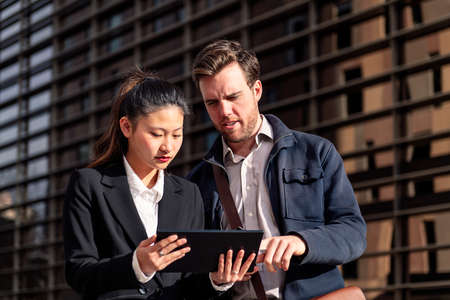 business woman showing tablet to entrepreneur manの写真素材
