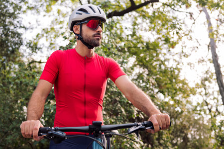 man dressing next to his van to go cyclingの写真素材