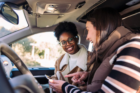 Multiethnic Friends Planning Road Trip in Camper