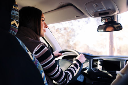 young woman driving camper van to new horizonsの写真素材