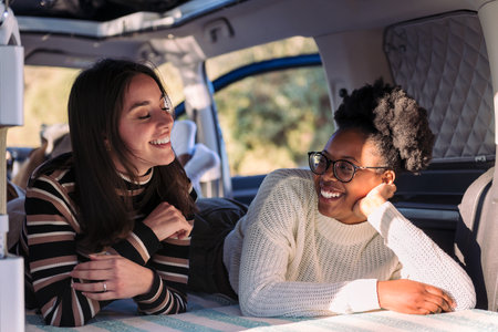 two young women enjoying van life relaxationの写真素材
