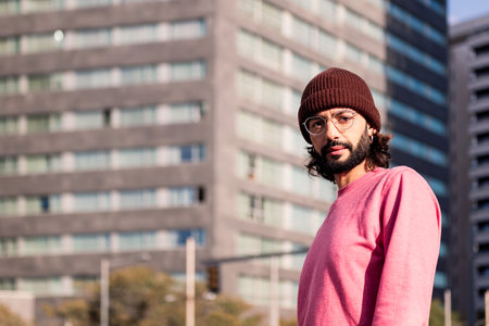 stylish young guy enjoying city morningの写真素材