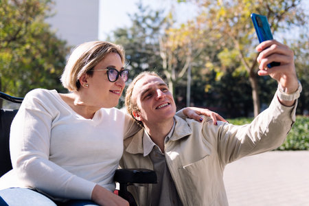 smiling couple taking selfie with mobile phone