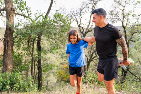 father and daughter doing sport in the countrysideの写真素材