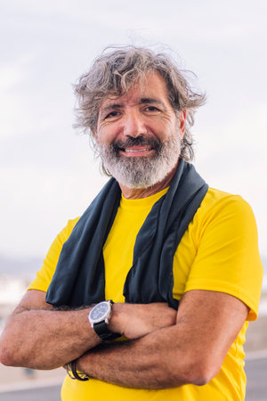 portrait of a sporty senior man smiling happyの写真素材