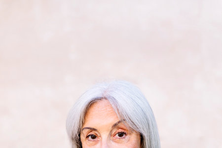 detail of the eyes of unrecognizable senior womanの写真素材