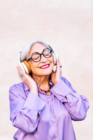 smiling senior woman enjoying listening to music