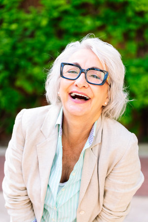 middle age woman laughing happy looking at camera