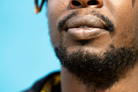 close-up of an attractive young black mans mouthの写真素材