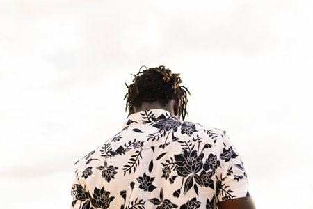 back view of a stylish young black manの写真素材