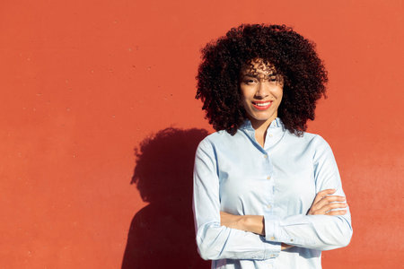 female entrepreneur standing with crossed armsの写真素材