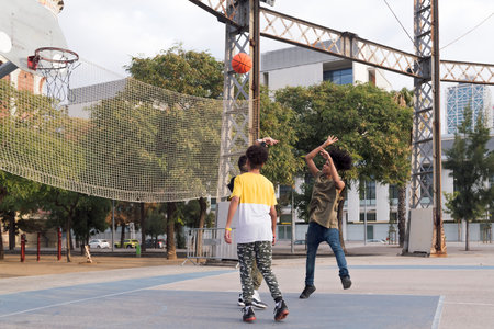 multiethnic friends having fun playing basketballの写真素材