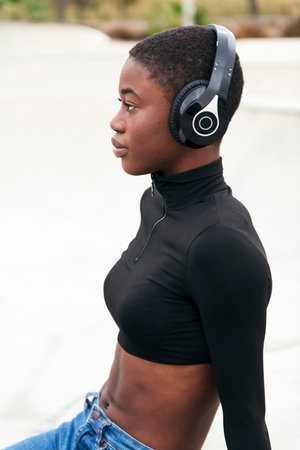 young african american female listening music