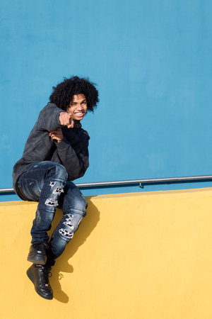 teenager smiling happy pointing looking at camera