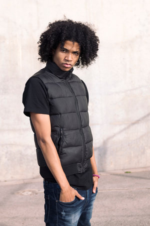 serious teenage boy looking at camera confidentの写真素材