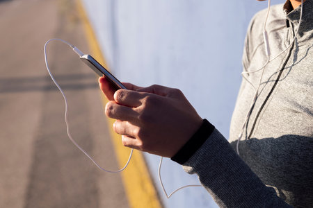 hands of unrecognizable woman using mobile phone