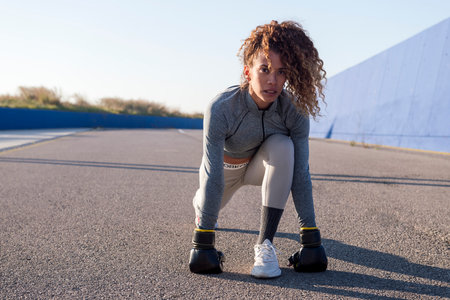 latin sports woman in sportswear during workout