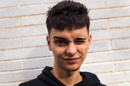 close up of a teen winking looking at camera