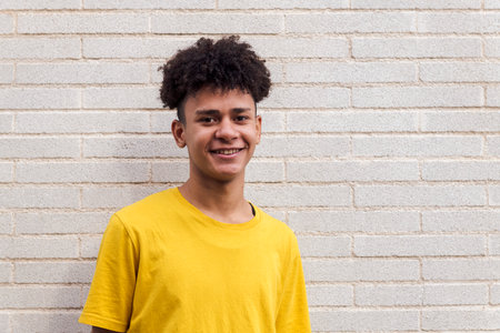 cheerful african american teenager smiling happilyの写真素材